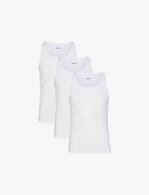 SKIMS Ribbed slim-fit pack of three stretch-cotton tank tops - CHALK in CHALK – Mens | Tops & t-shirts | T-Shirts | Plain T-Shirts