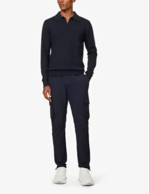 ARNE Tapered-leg mid-rise stretch-woven trousers detail 2