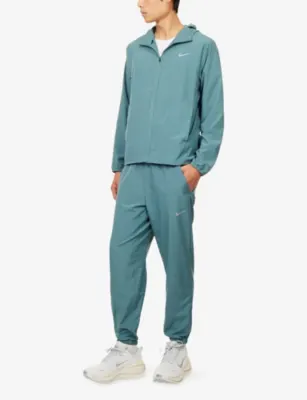 NIKE Dri-Fit Tapered-Leg Lightweight Woven Jogging Bottoms detail 2